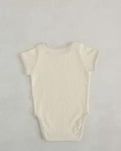 Detailed back view of baby ribbed short sleeve onesie with contrast trim, breathable cotton.