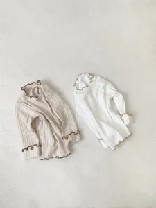 Infant baby girl long sleeve ribbed t-shirt, cute lettuce edge design, soft fabric detail.