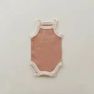 Detailed view of cute baby summer tank romper, soft knit fabric with contrast color trim.