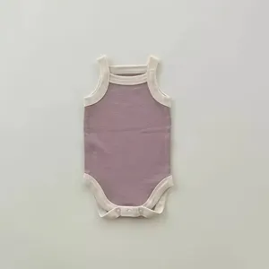 Baby summer strap romper detail, soft breathable fabric, sleeveless design with contrast trim.