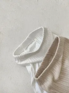Infant baby ribbed cotton separate lounge set fabric detail, soft texture in white and khaki.