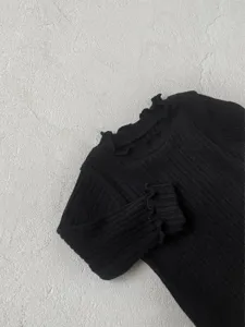 Black ribbed long sleeve baby t-shirt with cute lettuce trim collar for everyday wear.
