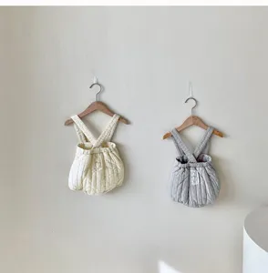 Cozy quilted baby romper with cross straps, cute thickened infant jumpsuit for autumn wear.