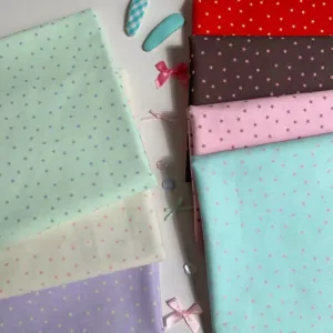 Close-up detail of Korean pastel star fabric for DIY crafts, desk decor and cute photo props.
