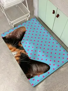 Detailed close-up shot of the cute blue cat ear polka dot plush bedside rug in room.