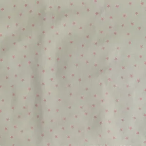 Detailed close-up view of the cute pink star print fabric texture and fine material details.