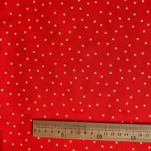 Red gold star print fabric tablecloth DIY handmade material detail flat lay design