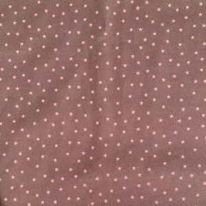 Detailed view of a brown fabric featuring cute pink star patterns, perfect for cozy aesthetic desks.