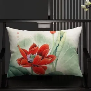 Detail shot of a Chinese style lotus print lumbar pillow placed on a dark wooden chair.