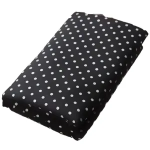 Black and white polka dot fabric for DIY sewing, cute tablecloth and home decor background.