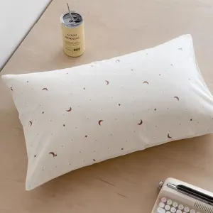 Detailed view of minimalist Korean style white pillow featuring cute moon and star pattern.