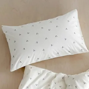 Detailed view of the Korean style white cherry print pillow cover, soft fabric texture close up.