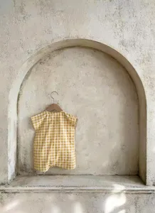 Detail view of the yellow checkered sleeveless baby cotton romper, perfect for summer daily wear.