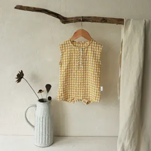 Infant yellow gingham sleeveless romper, cute baby cotton one-piece bodysuit detail.