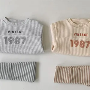 Infant waffle cotton long sleeve sweatshirt and striped pants set for spring and autumn daily wear.