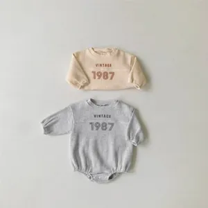 Infant baby waffle knit romper and top set, vintage 1987 print, soft long sleeve design.