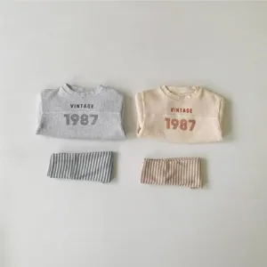 Infant waffle knit top and striped pants set, cute baby vintage style outfit for spring.