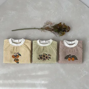 Cute infant checkered romper baby jumpsuit set with floral and fruit print, comfortable spring wear.
