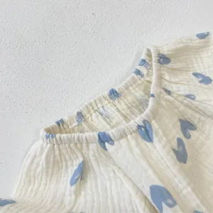 Cute baby girl cotton gauze romper detail with blue heart print and elastic collar summer style.