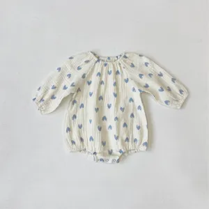 Adorable newborn baby long-sleeve cotton gauze romper with blue heart print, soft and cute.