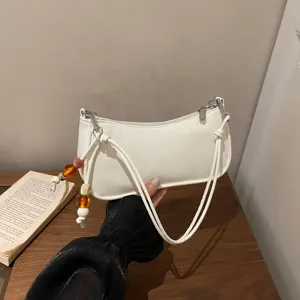 Stylish minimalist white shoulder baguette bag for women, chic casual underarm daily purse.