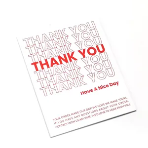 Close-up detail of white and red thank you card packaging sticker with elegant typography.