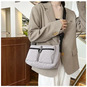Casual women's crossbody bag with dual front zipper pockets, stylish light grey daily shoulder bag.