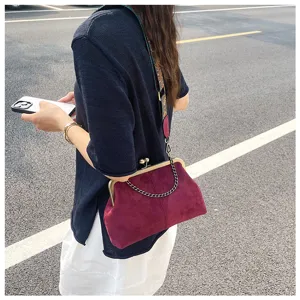 Vintage wine red suede kiss lock shoulder crossbody bag with metal chain detail for women commute.