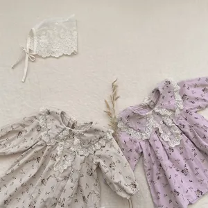 Adorable floral toddler dress detail with delicate lace collar and matching bonnet set.