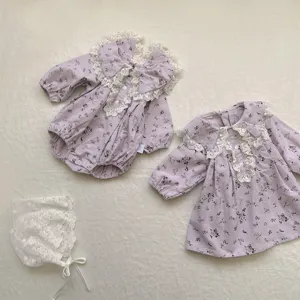 Detail view of toddler girls floral long sleeve dress romper set with lace lapel collar.