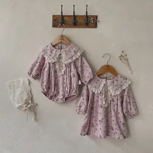 Girls floral lace collar long sleeve dress and baby romper set with matching bonnet.