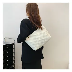 White quilted chain tote bag for women, large capacity shoulder bag with elegant design.