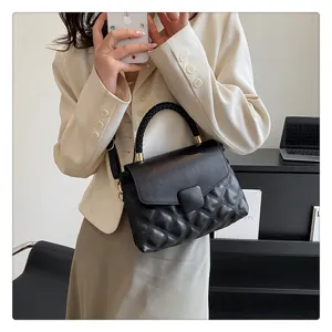 Women's stylish black quilted flap crossbody bag with braided top handle for daily use.
