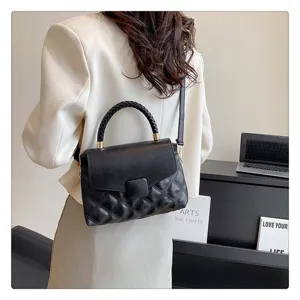 Black quilted flap handbag with braided top handle and shoulder strap for women daily use.