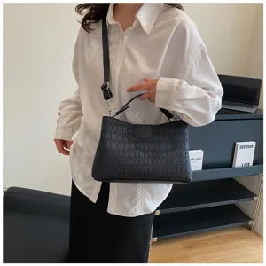 Black crocodile pattern women shoulder bag detail shot, stylish crossbody handbag for daily.
