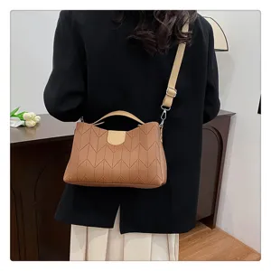 Stylish brown chic shoulder bag with elegant chevron pattern for modern women daily use.