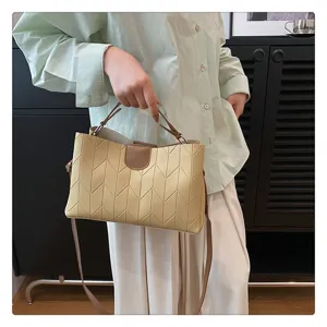Detailed view of the casual women's shoulder bag featuring unique bamboo textured stitching.