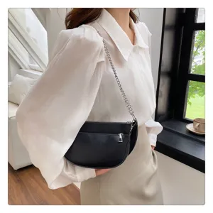 Detailed view of the black leather hobo shoulder bag featuring stylish silver chain strap.