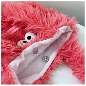 Pink fluffy plush tote bag with cute cartoon eyes, soft shaggy shoulder bag for women.