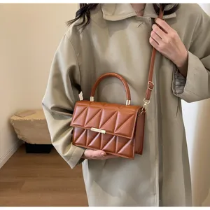 Chic brown quilted square shoulder bag for women, stylish crossbody handbag with top handle.