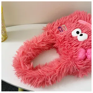 Cute pink fluffy plush shoulder bag for women winter fuzzy tote bag with funny cartoon eyes.