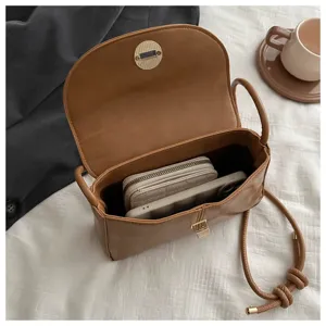 Detailed interior view of stylish brown PU leather crossbody bag showing great daily capacity.