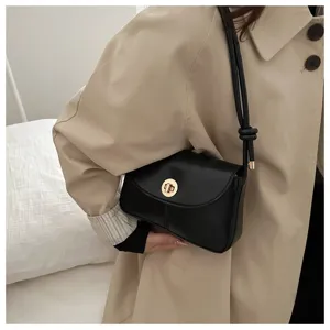 Classic black shoulder bag with gold turn-lock, stylish minimalist crossbody bag for women.