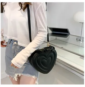 Stylish black quilted heart crossbody bag for women, trendy retro PU leather shoulder bag.
