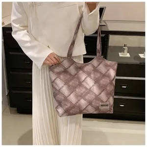 Large capacity woven tote bag stylish shoulder bag for daily commuting and school use.