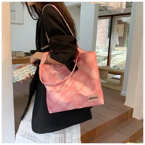 Detailed view of the pink tie-dye tote bag, featuring large capacity and casual shoulder strap.