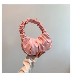 Pink ruched cloud bag detail, soft pleats hobo shoulder handbag, chic minimalist aesthetic.
