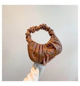 Brown PU leather ruched shoulder bag detail, stylish dumpling hobo bag close-up view.