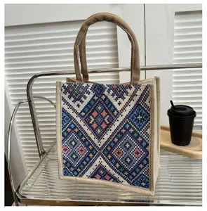 Ethnic geometric pattern jute canvas handbag detail view, casual tote bag with double handles.