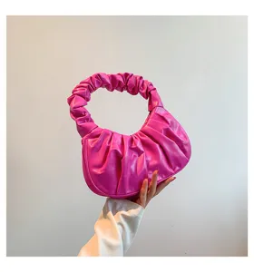 Detail view of stylish pink pleated cloud shoulder bag, perfect for chic retro daily outfits.